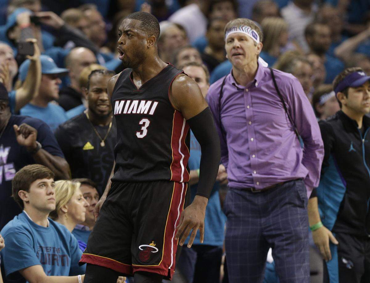Miami Heat’s Dwyane Wade (3) reacts after making a 3-point basket against the Charlotte Hornets during the second half in Game 6 of an NBA basketball playoffs first-round series in Charlotte, N.C., Friday, April 29, 2016. The Heat won 97-90.