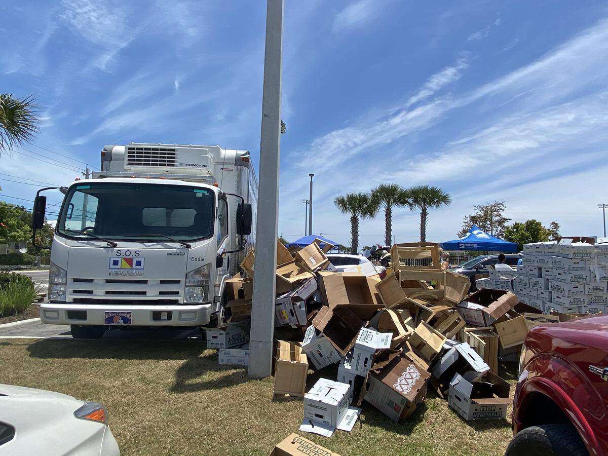 Empty boxes show the need for food in the Florida Keys at a food distribution site on Stock Island on May 7, 2020.