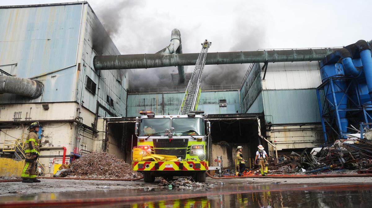 Miami-Dade firefighters work to extinguish the fire at the Covanta incinerator plant in Doral last year.