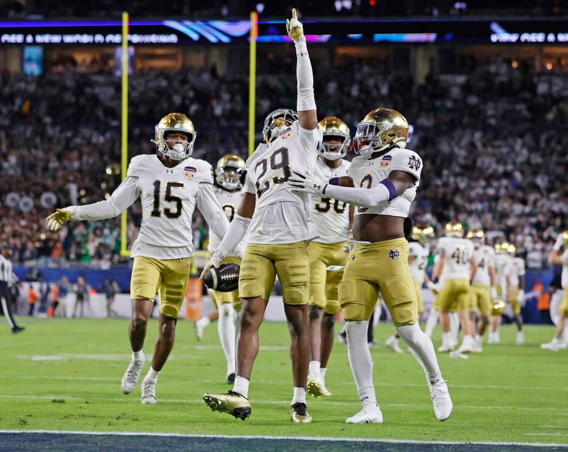 Notre Dame Fighting Irish cornerback Christian Gray (29) celebrates with teammates after he intercepts a Penn State Nittany Lions pass in the second half of their NCAA Playoff Semifinal Capital One Orange Bowl football game at Hard Rock Stadium in Miami Gardens, Florida on Thursday, January 9, 2025.