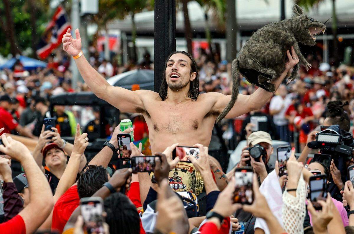 Florida Panthers left wing Ryan Lomberg (94) holds a rat during the Florida Panthers Stanley Cup victory parade along A1A in Fort Lauderdale, Florida on Sunday, June 30, 2024. 