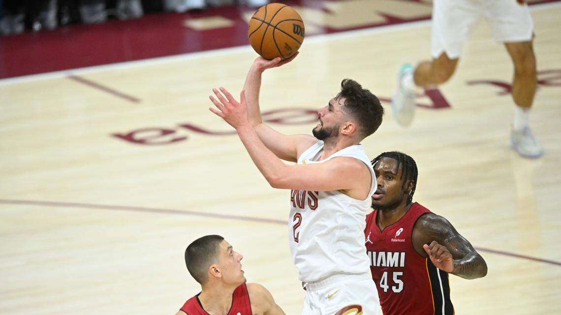 Cleveland Cavaliers guard Ty Jerome (2) shoots between Miami Heat guard Tyler Herro (14) and guard Davion Mitchell (45) in the fourth quarter at Rocket Arena.