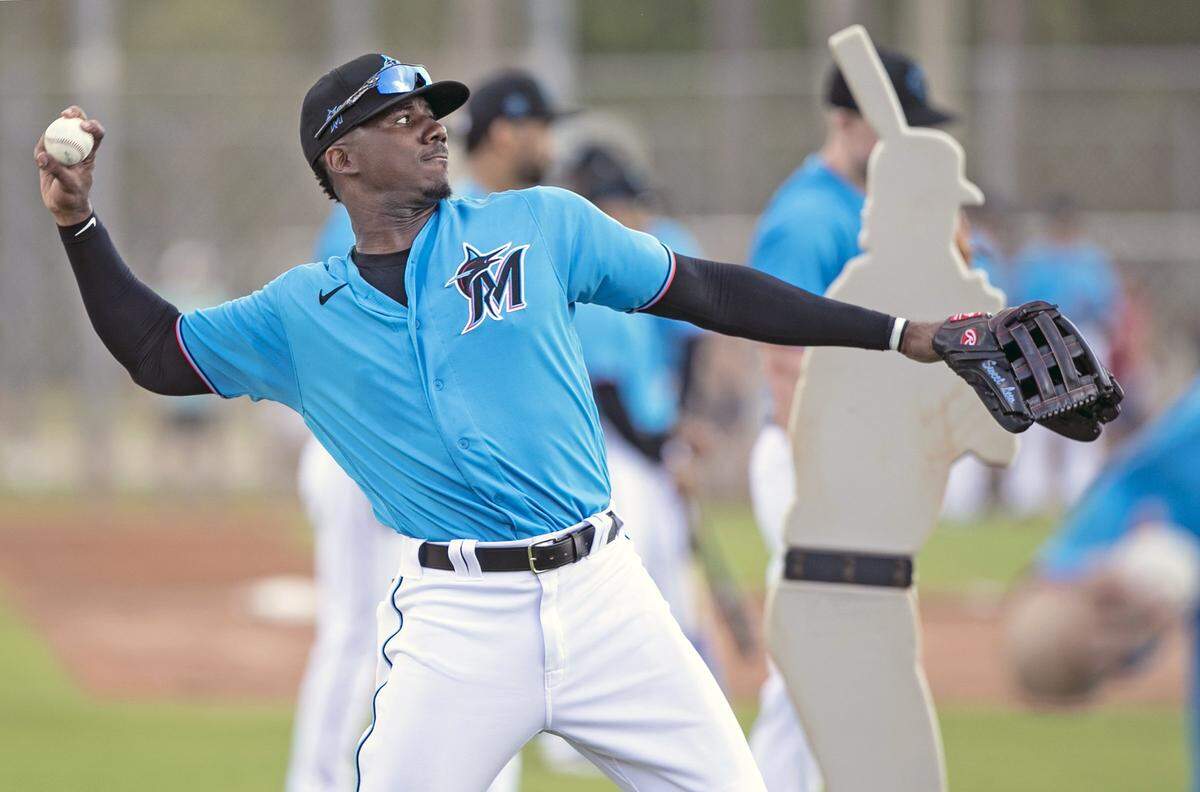 Miami Marlins outfielder Lewis Brinson (25) throws during spring training at the Roger Dean Chevrolet Stadium in Jupiter on Wednesday, February 19, 2020.