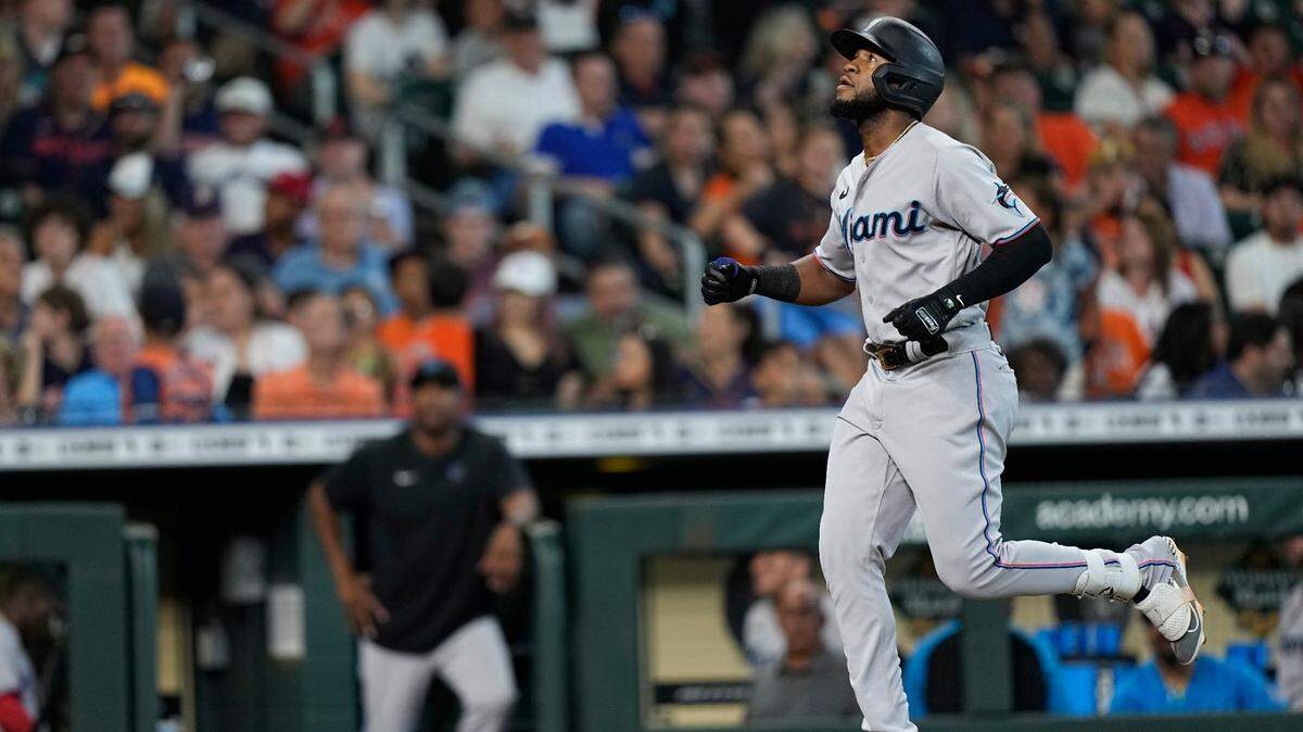 Miami Marlins’ Bryan De La Cruz celebrates after hitting a three-run home run against the Houston Astros during the seventh inning of a baseball game Sunday, June 12, 2022, in Houston. (AP Photo/David J. Phillip)