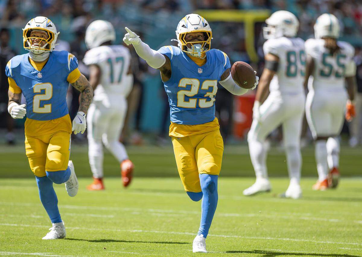 Los Angeles Chargers safety Tony Jefferson (23) reacts after intercepting the ball against the Miami Dolphins in the first half of their NFL game at Hard Rock Stadium on Sunday, Oct. 12, 2025, in Miami Gardens, Fla.