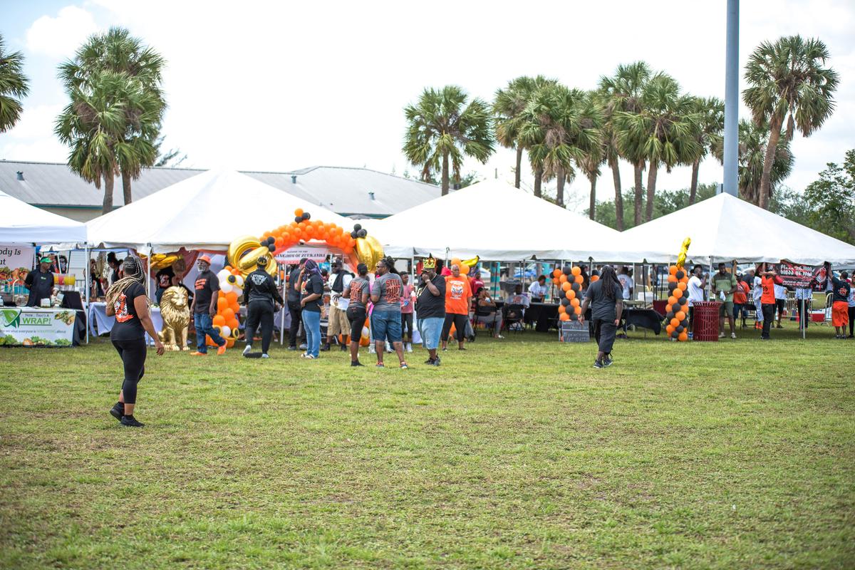 People gather at the class tents at the Chief Hall Picnic in Miami Gardens, Florida on Saturday, April 14, 2018. Each class usually comes up with a theme for their tent as a way to showcase their love for Miami Carol City Senior High School.