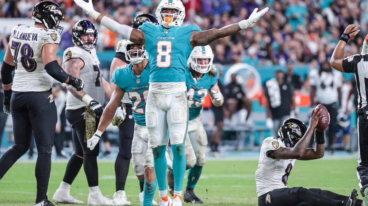 Miami Dolphins free safety Jevon Holland (8) reacts after Baltimore Ravens quarterback Lamar Jackson (8) is sacked in the second half at Hard Rock Stadium on Thursday, November 11, 2021
