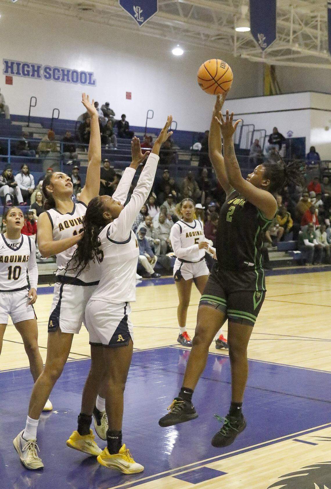 Nova Lady Titans Jaelynn Housey (2) attempts a shot against St. Thomas Aquinas Raiders during the BCAA Big 8 girls basketball tournament final game on Saturday, January 31, 2026 at Fort Lauderdale HS in Fort Lauderdale. Andrew Uloza / for Miami Herald