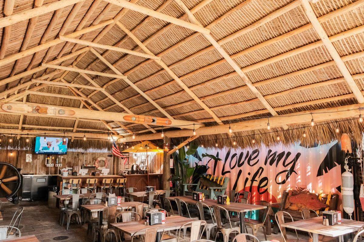 The new tiki hut, built after the original burned in a July 4, 2022 fire, at Golden Rule seafood features a new bar.