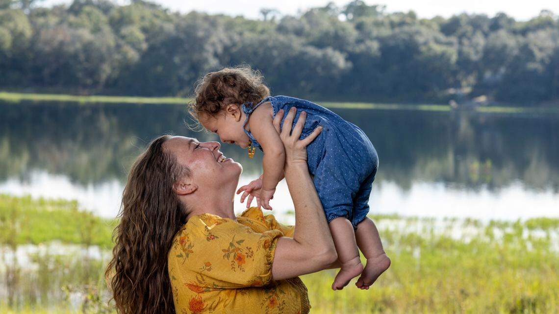 Mandi Rokx of Melrose, Florida, was cut from Medicaid three months after delivering her daughter, Vernita, in February. An unknown number of Florida mothers have been disenrolled from Medicaid despite being eligible for 12 months of continuous coverage. (David Steele for KFF Health News)
