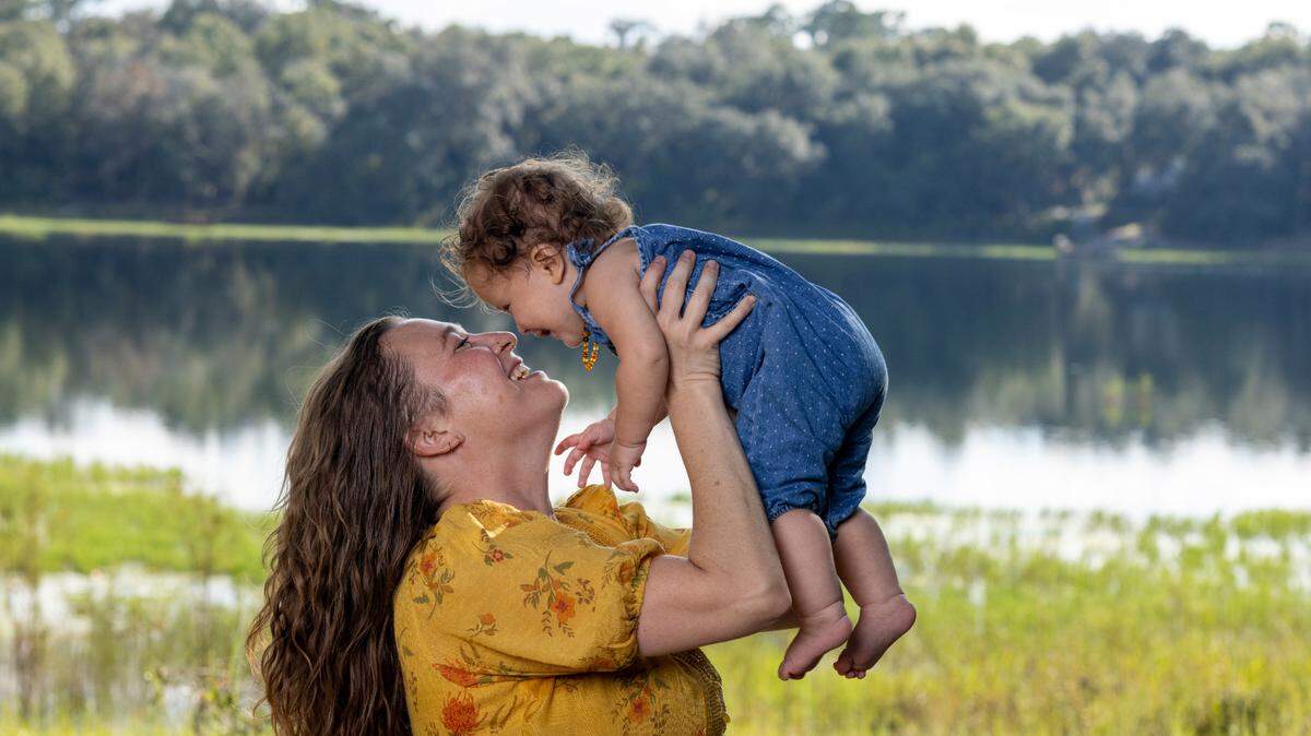 Mandi Rokx of Melrose, Florida, was cut from Medicaid three months after delivering her daughter, Vernita, in February. An unknown number of Florida mothers have been disenrolled from Medicaid despite being eligible for 12 months of continuous coverage. (David Steele for KFF Health News)