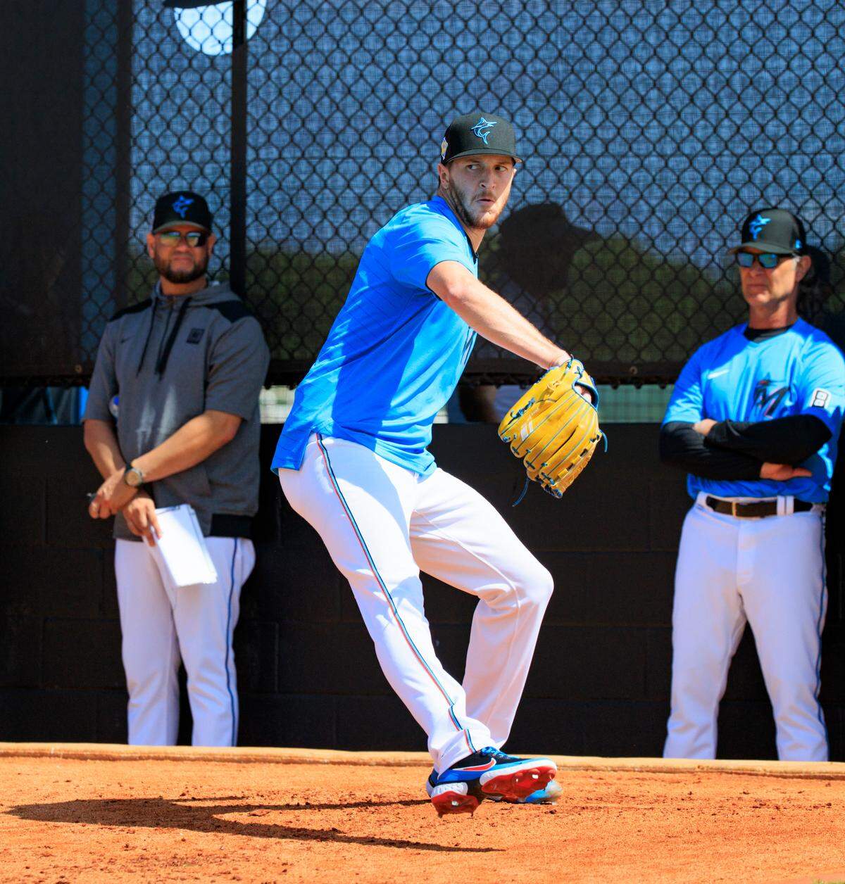Miami Marlins manager Don Mattingly looks on as Marlins pitcher Trevor Rogers throws during the first full-squad spring training workout at Roger Dean Stadium on Monday, March 14, 2022 in Jupiter, FL.
