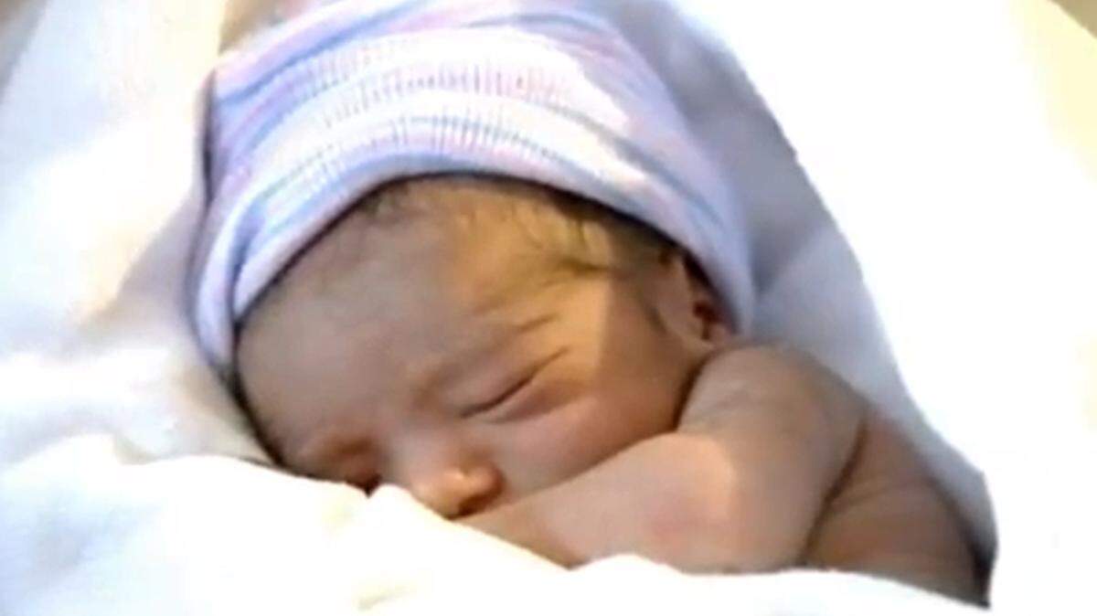 In an image made from WABC-TV video, a newborn boy sleeps at St. Lukes-Roosevelt Hospital in New York after being born on a PATH commuter train from New Jersey Monday, Jan. 16, 2011.