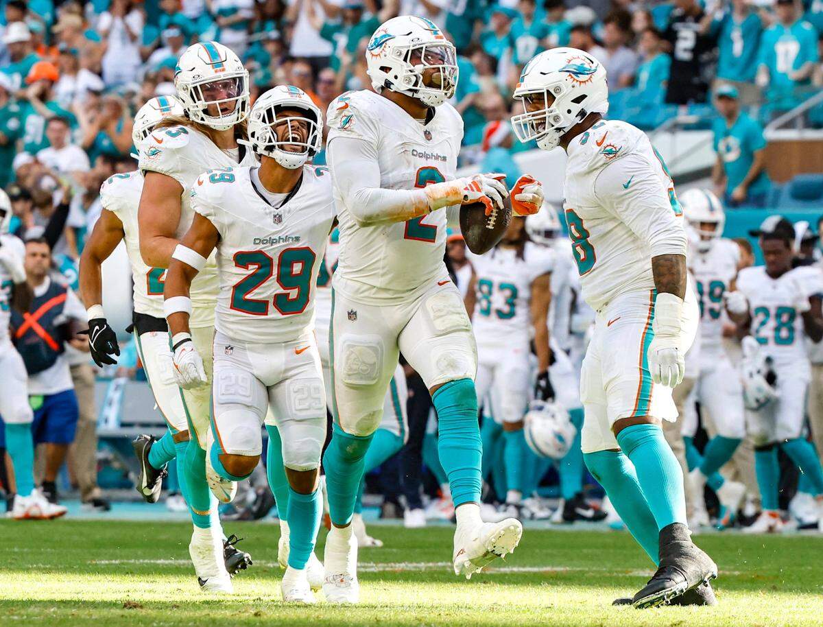 Miami Dolphins linebacker Bradley Chubb (2)celebrates with teammates after stripping the ball from New York Jets quarterback Trevor Siemian (14) in the second half at Hard Rock Stadium in Miami Gardens, Florida on Sunday, December 17, 2023.