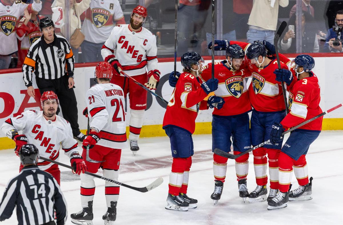 Florida Panthers defenseman Niko Mikkola (77) celebrates with teammates Aleksander Barkov (16), Jesper Boqvist (70), and Seth Jones (3) after scoring a first-period goal against the Carolina Hurricanes in Game 3 of the Eastern Conference Final during the NHL Stanley Cup Playoffs at Amerant Bank Arena on Saturday, May 24, 2025, in Sunrise, Fla.