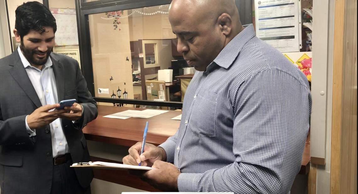 Former Miami-Dade Democratic Party chairman Juan Cuba, left, and Rob Piper, right, filed paperwork at Miami City Hall to launch a recall petition against Commissioner Joe Carollo.