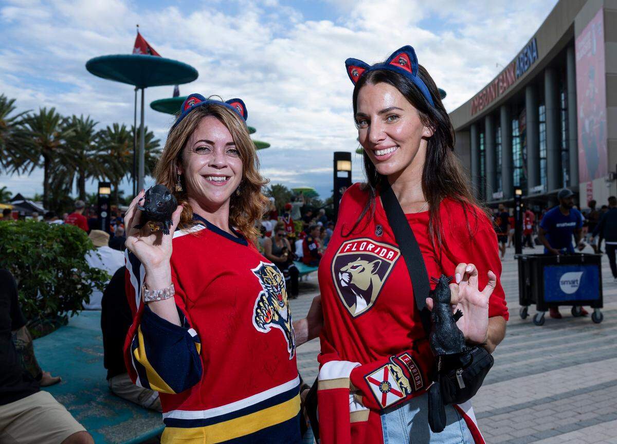 Florida Panthers fans Kelly Cuffari, left, and Erika Roy, show-off their rats as they arrive to the Amerant Bank Arena to watch their team play against the Edmonton Oilers in Game 7 of the Stanley Cup Final
