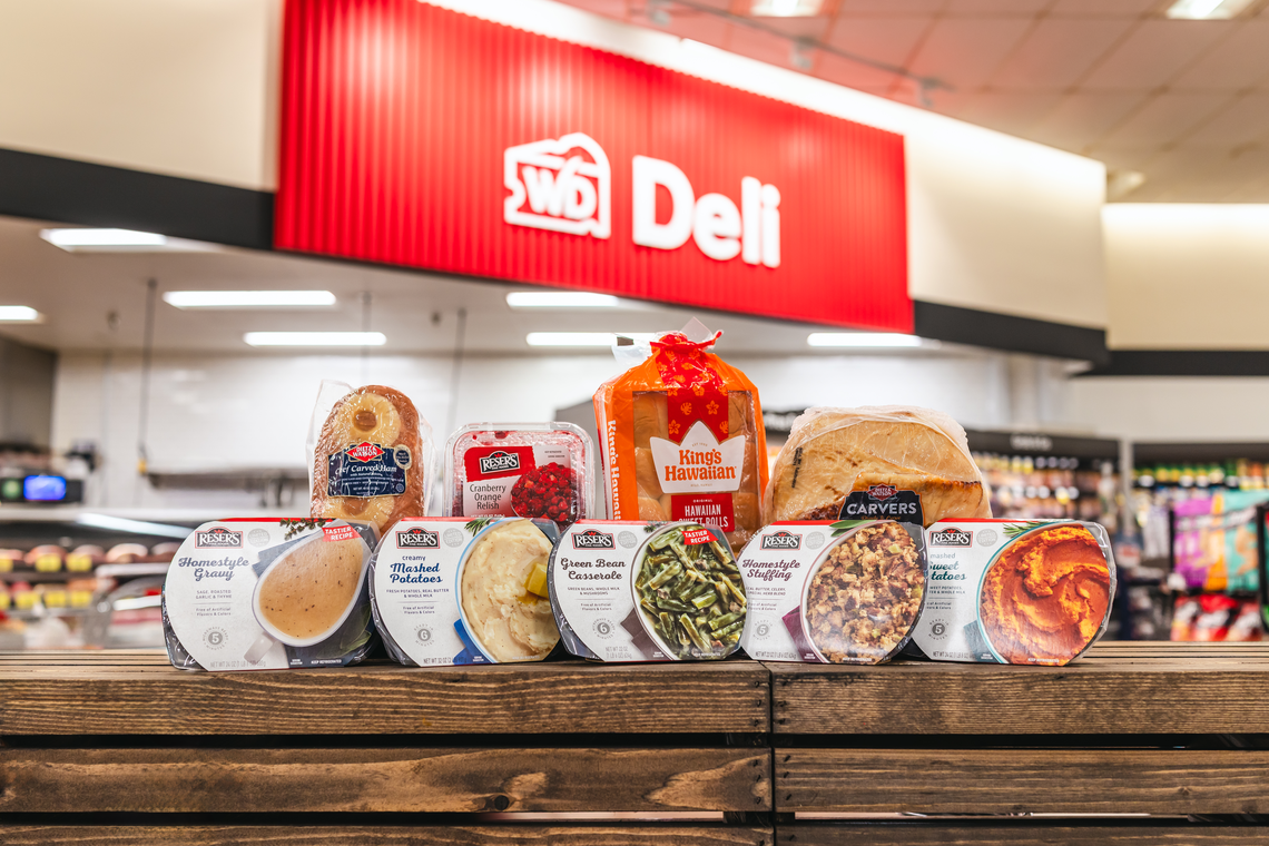 Winn-Dixie’s Holiday Meal Deal for the 2025 Thanksgiving through New Year’s Day holidays season offers a choice of one Dietz & Watson Carver Ham or Turkey heat-and-serve meal for $39.99 at the deli with a choice of four Reser’s sides.