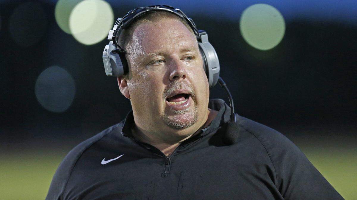 North Marion High School Coach Stephen Field on the field as Booker T. Washington hosts North Marion at Traz Powell Stadium in a preseason game on Friday, August 21, 2015.