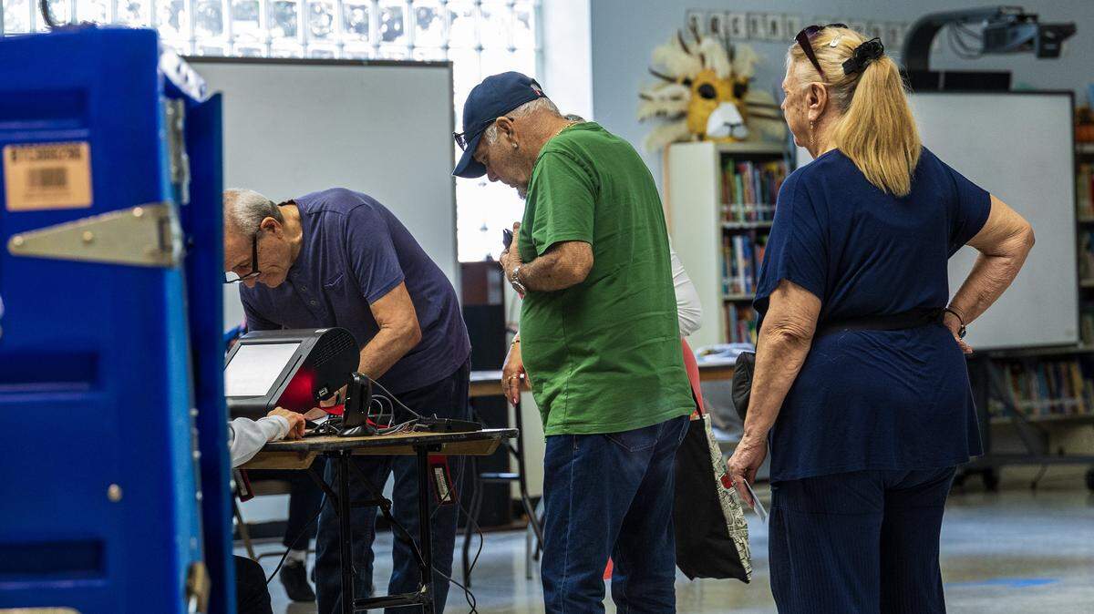 Miami Beach residents lined up to check in with poll workers  during the Election Day on November 4, City of Miami Beach general municipal and special elections, at the South Point Elementary School voting poll location, on November 4, 2025.
