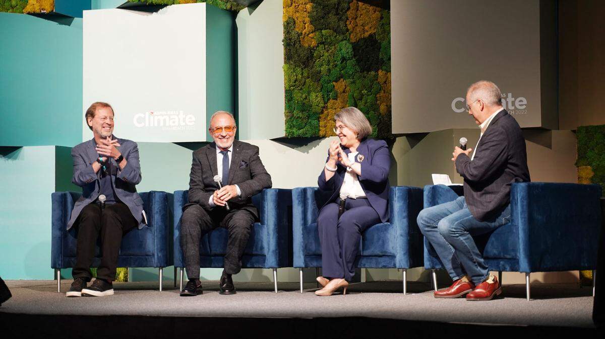 Aspen Institute CEO Dan Porterfield, music producer Emilio Estefan, Miami-Dade Mayor Daniella Levine Cava and Miami Beach Mayor Dan Gelber speak on a panel about climate change at Aspen Ideas Climate in Miami Beach on May 12, 2022.