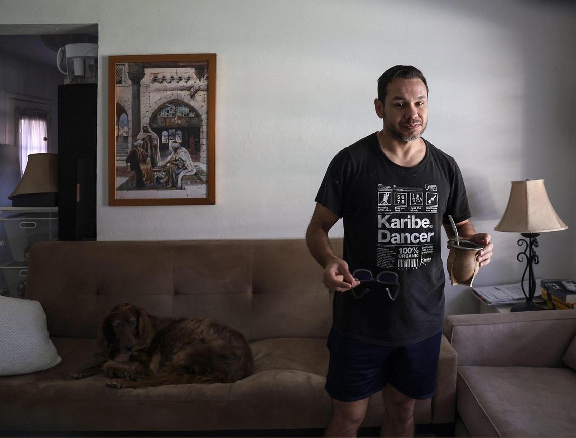 Giancarlo Messina, with his Irish setter, Simona, on the sofa of his living room, speaks about the impending demolition of the small Coral Gables building where he’s rented an apartment for eight years. The building is one of 13 affordable, older small apartment buildings and duplexes covering a full city block that will be demolished to make way for a luxury residential development. Dozens of residents in 52 apartments will be displaced. The block is bounded by Malaga Avenue and Santander Avenue to the north and south, and Segovia Street and Hernando Street on the west and east.