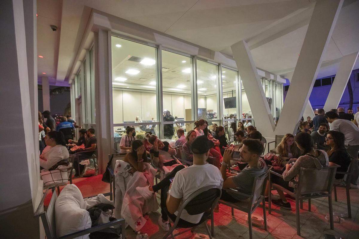 Relatives and friends wait for search-and-rescue updates at the family reunification center at the Surfside Community Center following the collapse of Champlain Towers South on June 24, 2021.