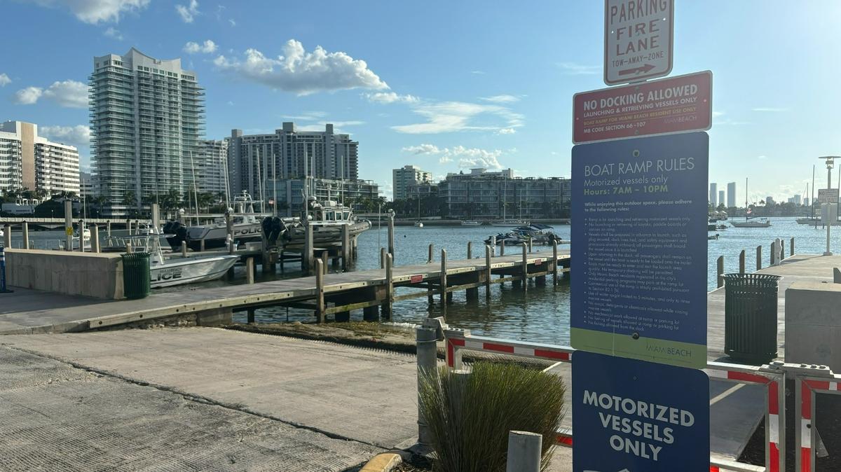 Signs detail restrictions for boaters at a ramp near Maurice Gibb Park in Miami Beach on Wednesday, Aug. 7, 2024. A new ordinance has made it more difficult for people who live on boats in nearby Sunset Harbour to access land.