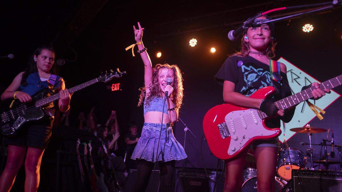 (L to R) Emla Berlin, Valentina Pereda, Eleni Sfakianaki at the Miami Girls Rock Camp at The Ground at Space, Miami; on Saturday, August 2, 2025. The all-ages event featured live performances from 10 brand-new camper bands, showcasing original songs created during camp week.