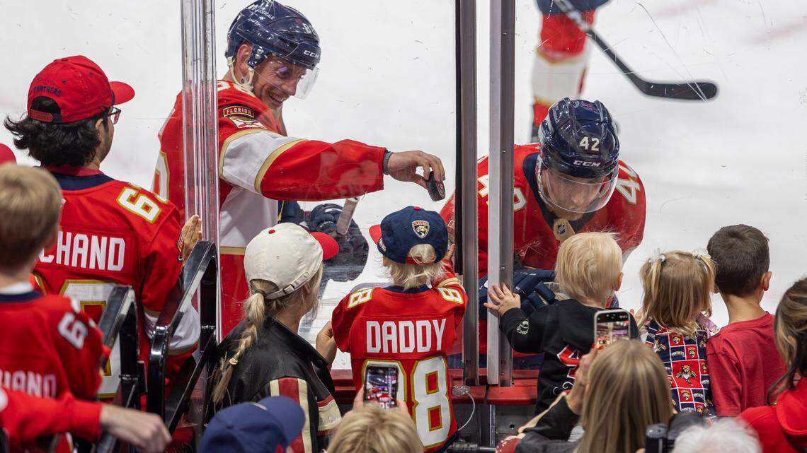 Florida Panthers defensemen Nate Schmidt (88) and Gustav Forsling (42) interact with their family before playing against the Carolina Hurricanes in Game 3 during the Eastern Conference final of the NHL Stanley Cup playoffs at Amerant Bank Arena on Saturday, May 24, 2025, in Sunrise, Fla.
