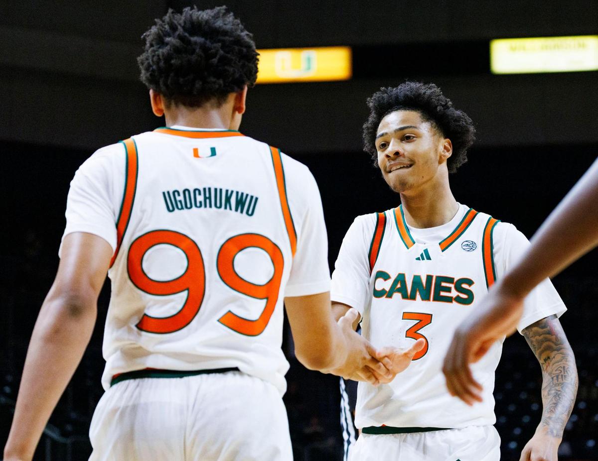 Miami (Fl) Hurricanes guard Jalil Bethea (3) high fives Divine Ugochukwu (99) on his shot during the first half of a game on Sunday, Nov. 10, 2024, at Watsco Center in Coral Gables, Fla.