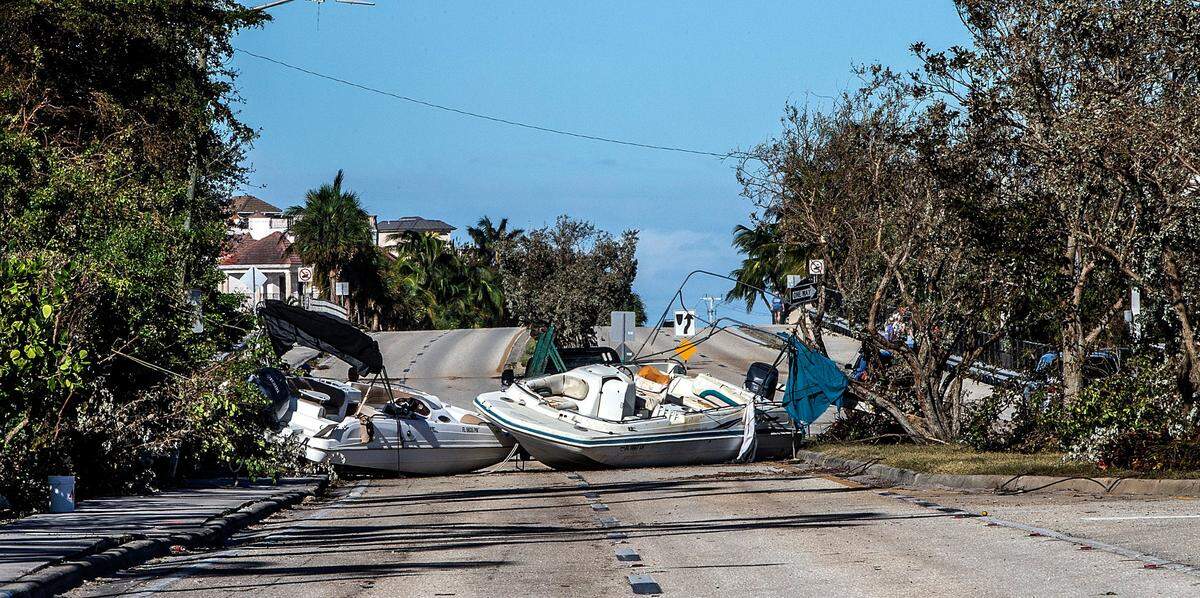 Boats are seen blocking Bonita Springs Roa, two days after Hurricane Ian hit Florida’s west coast as a Category 4 storm, on Friday September 30, 2022.