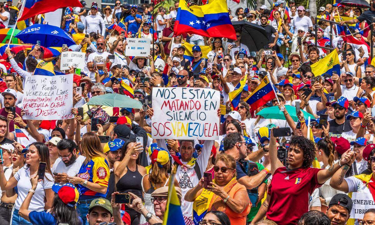 Venezuelans living in South Florida make their voices heard at Bayfront Park in Downtown Miami
