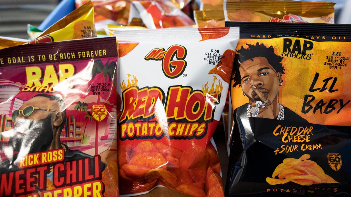 Rap Snacks chip bags sit inside company headquarters on Monday, Feb. 26, 2024, in downtown Miami. Rick Ross and Lil Baby are two artists featured on the bags.