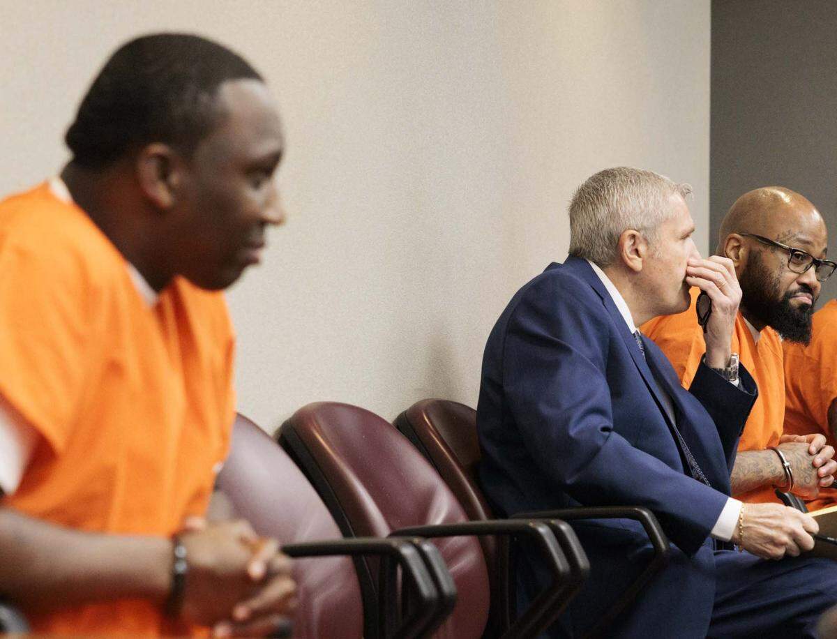 Roderick Martin, left, and Reginald Louis Jackson, right, both accused of 2013 double murder of a church minister and her grandson in her Miami Gardens home, sit in the box before pleading guilty and receiving sentencing on Wednesday, April 29, 2026, inside the Richard E. Gerstein Justice Building in downtown Miami, Fla.