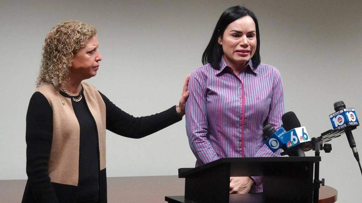 U.S. Rep. Debbie Wasserman Schultz, left, comforts Anabely Lopes, who had to leave Florida for an abortion. Her fetus had fatal condition.