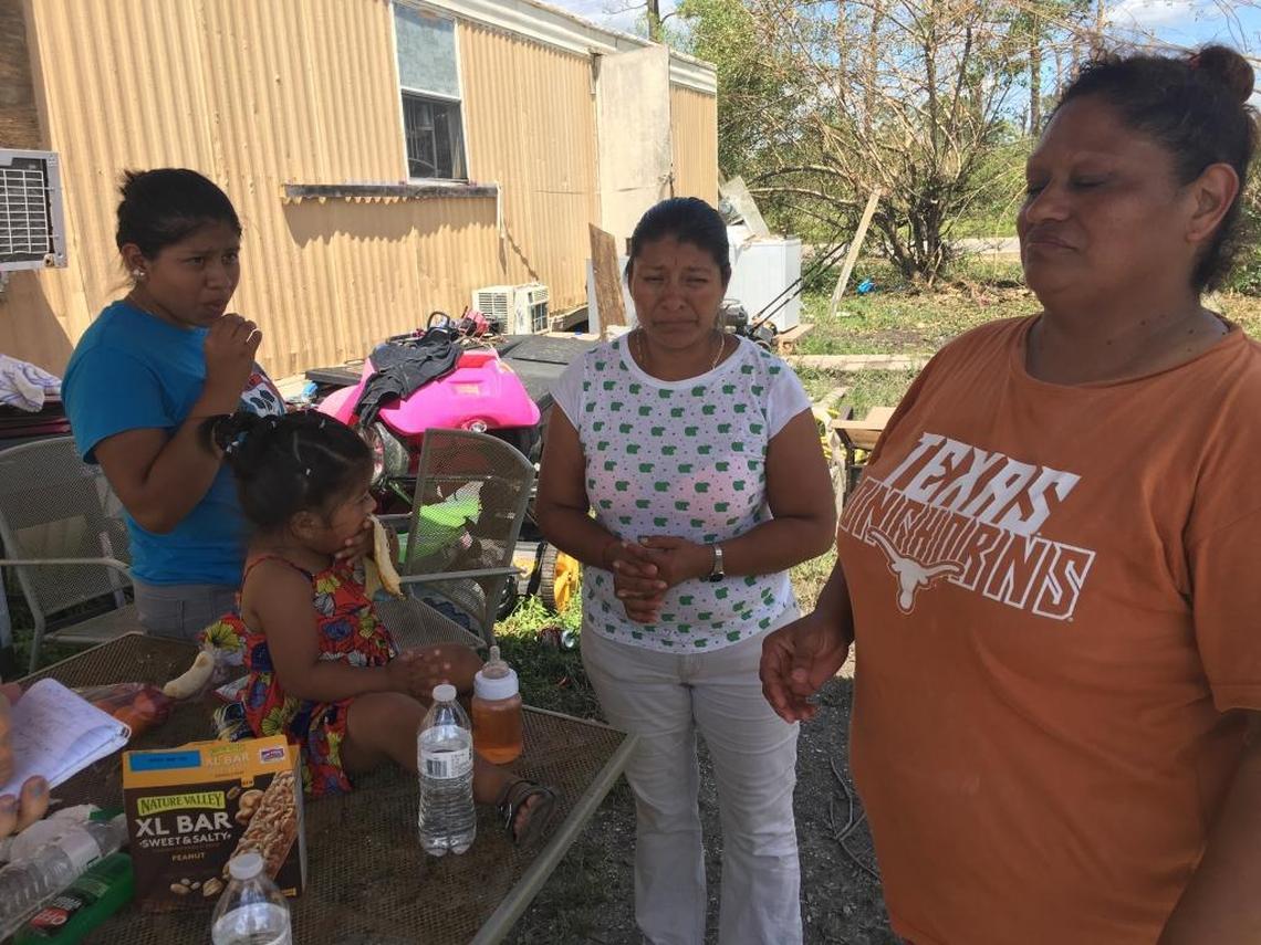 Anita Martinez, in orange t-shirt, is providing housing for Eustolia Flores and her family. Flores, who is joined by her daughters, Florena Galindo, 17, and Jocelyn Flores, 21 months, fled Hurricane Irma for Jacksonville, only to return home to find her mobile home in Immokalee destroyed.