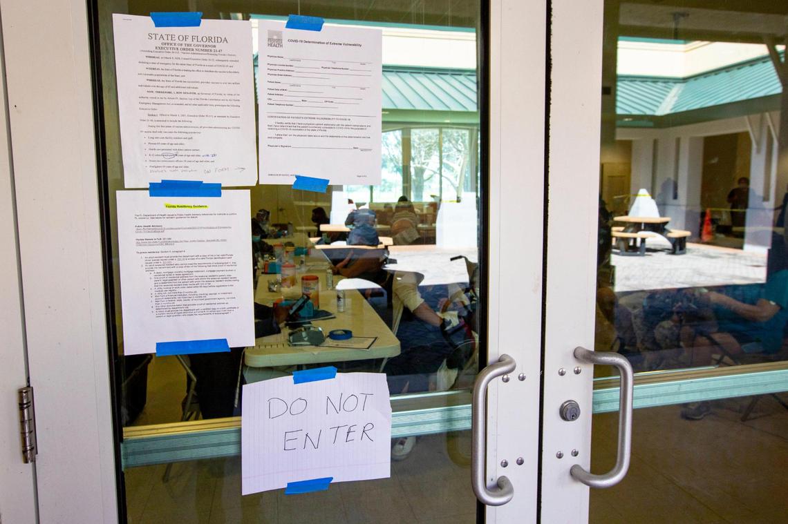 A copy of Gov. Ron DeSantis’ Executive Order 21-47 with the current limitations on who can get vaccinated at state sites is posted outside the FEMA Florida City vaccination site at the Florida City Youth Center in Florida, on Sunday, March 7, 2021.