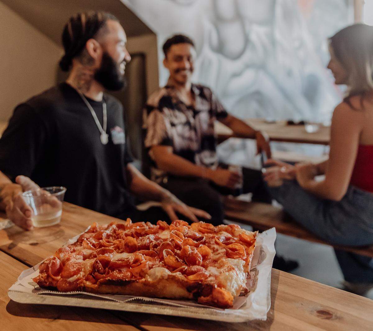 Square Pie City serves square Detroit-style pizza with a crispy crust.