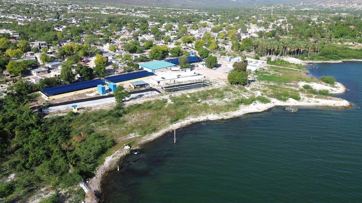 An aerial view of Haiti’s Fond-Parisien lakeside village east of Port-au-Prince. Following fresh attacks on neighboring Ganthier, residents of Fond-Parisien are panicking over a possible assault that could turn the border town to ashes.