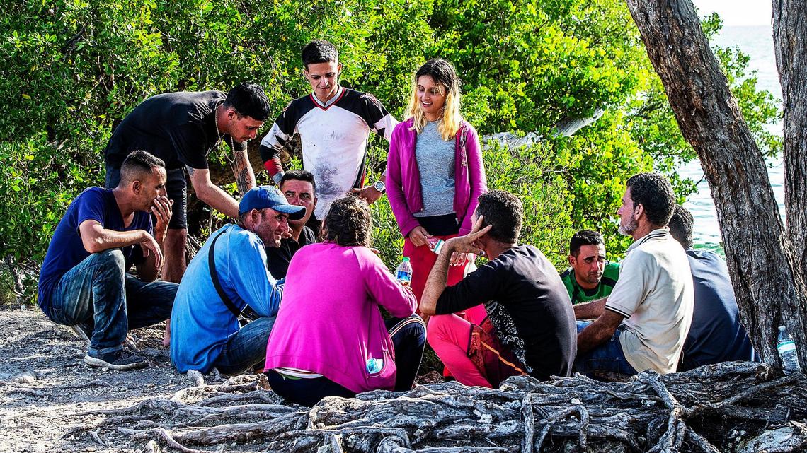 Cuban migrants from Matanzas stand in the sun on the side of U.S. 1 on the Middle Keys island of Duck Key on Jan 2.