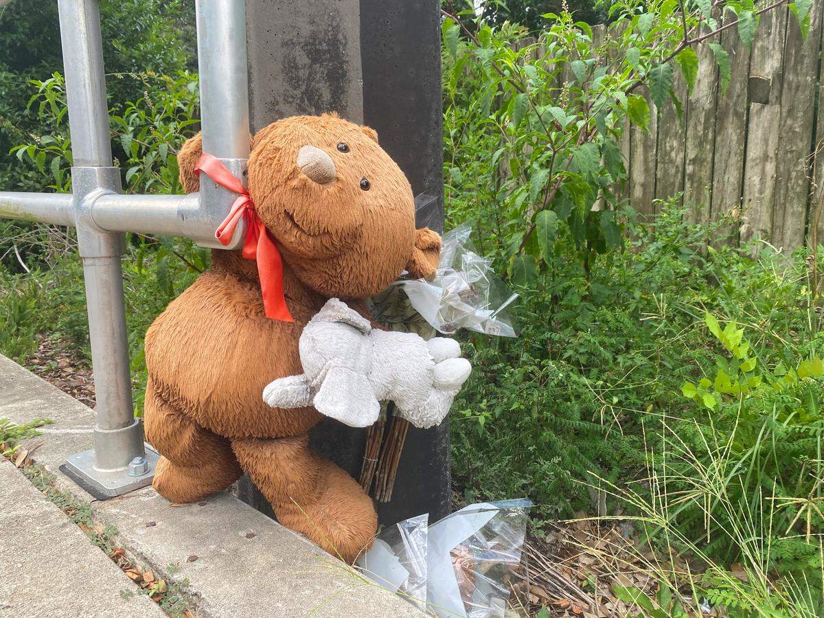 A teddy bear, part of a makeshift memorial for Kassandra Guzman-Ramirez, is seen in the 2500 block of West University Avenue on Sunday afternoon, July 26, 2020. Guzman-Ramirez, a 20-year-old from Weston, Fla., died when the vehicle she was riding in crashed into a guardrail and utility pole at that location on January 9, 2020.