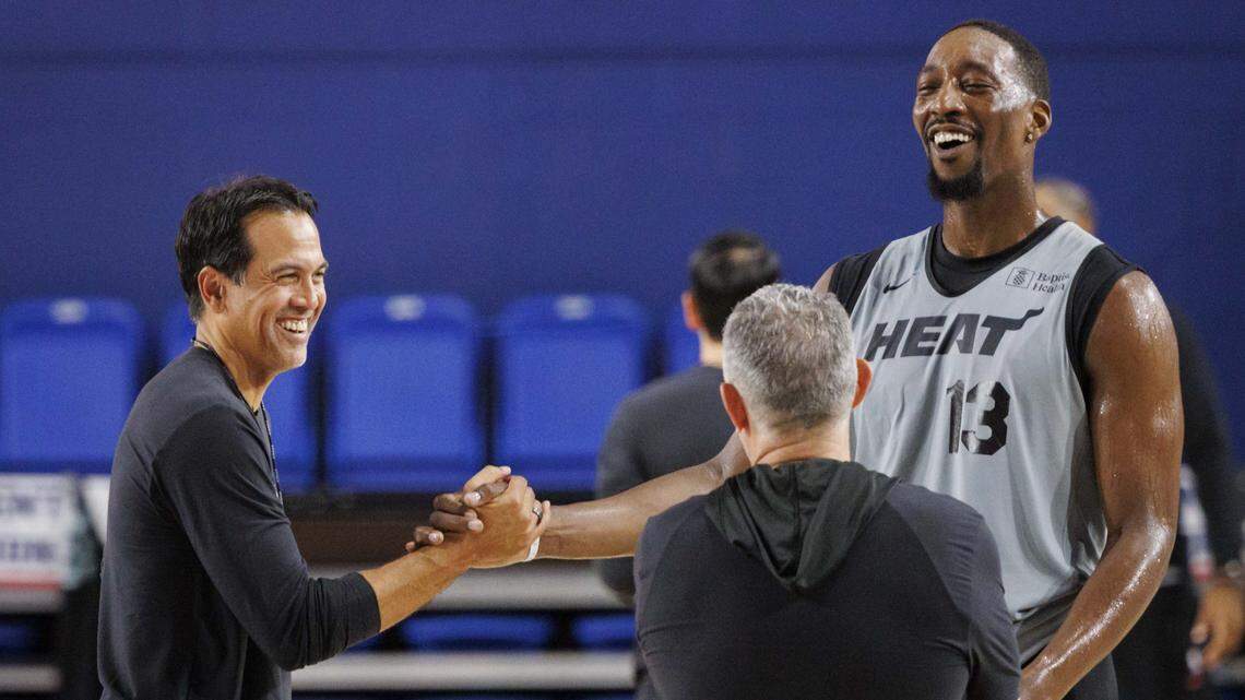 Bam Adebayo (13) shakes hands with head coach Erik Spoelstra during the second day of Miami Heat Training Camp on Oct. 1, 2025, at Florida Atlantic University in Boca Raton.