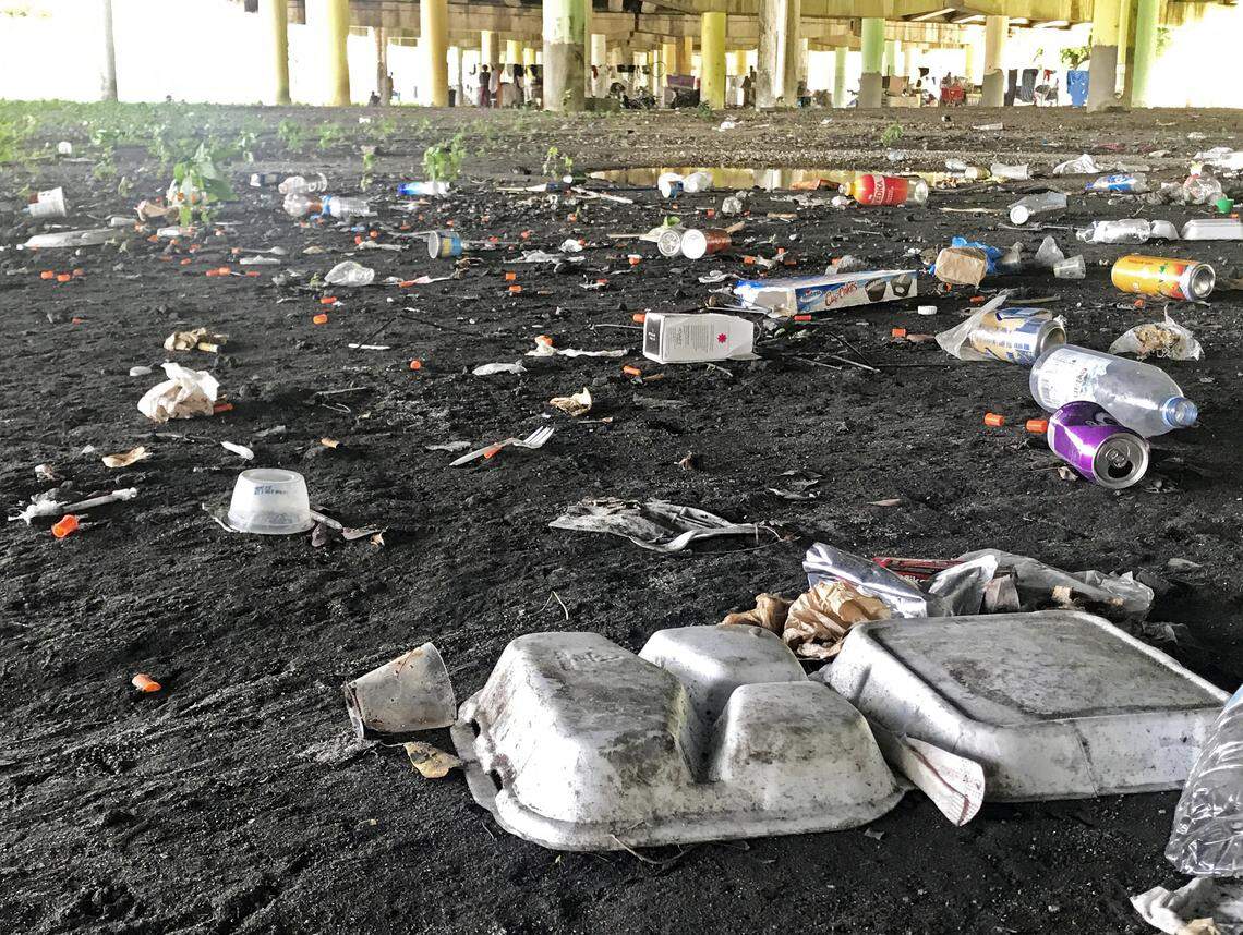 Many discarded needles are among the trash strewn under an 836 overpass in Overtown.