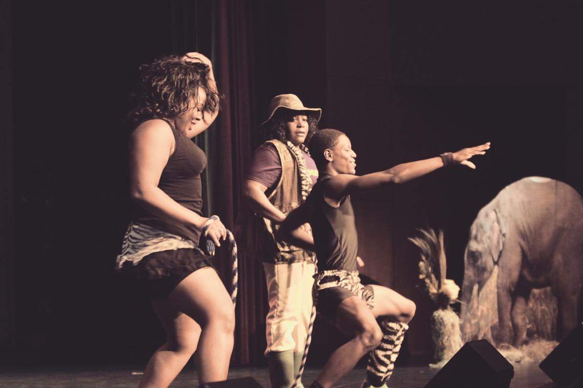 Karen Makange (hat) performs with Kenya Safari Acrobats. She struggled to get her Paycheck Protection Program loan for the group forgiven.