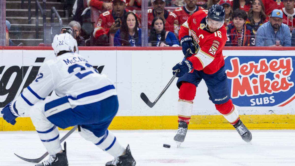 Florida Panthers center Aleksander Barkov (16) shoots the puck as Toronto Maple Leafs defenseman Jake McCabe (22) defends in the first period of Game 6 of a second-round Stanley Cup playoffs series at the Amerant Bank Arena on Friday, May 16, 2025, in Sunrise, Fla.