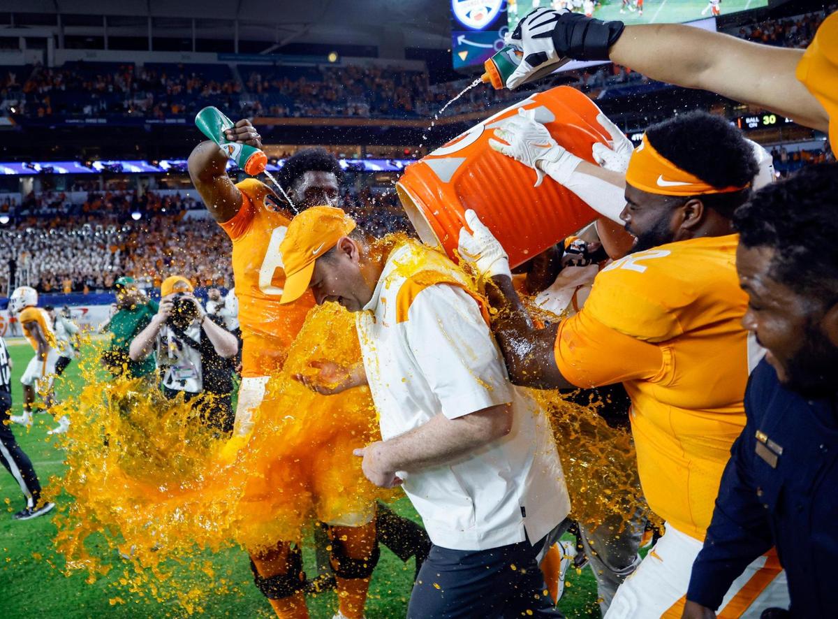Tennessee Volunteers head coach Josh Heupel gets dunked after the Volunteers defeat Clemson Tigers at Hard Rock Stadium in Miami Gardens, Florida on Saturday, December 31, 2022.