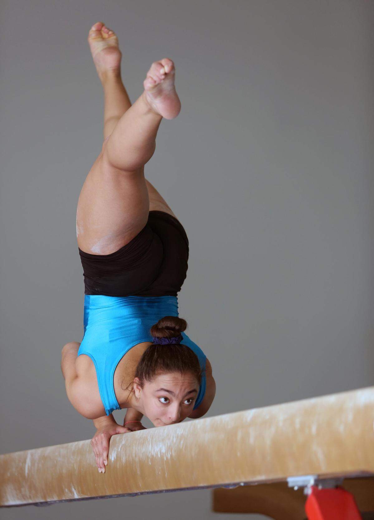 Bianca Leon, who in July won a gold medal representing Puerto Rico in the Central American and Caribbean Games, practices at Leyva Gymnastics in Kendall on Wednesday, Aug. 15, 2018.  Her specialty is the balance beam.