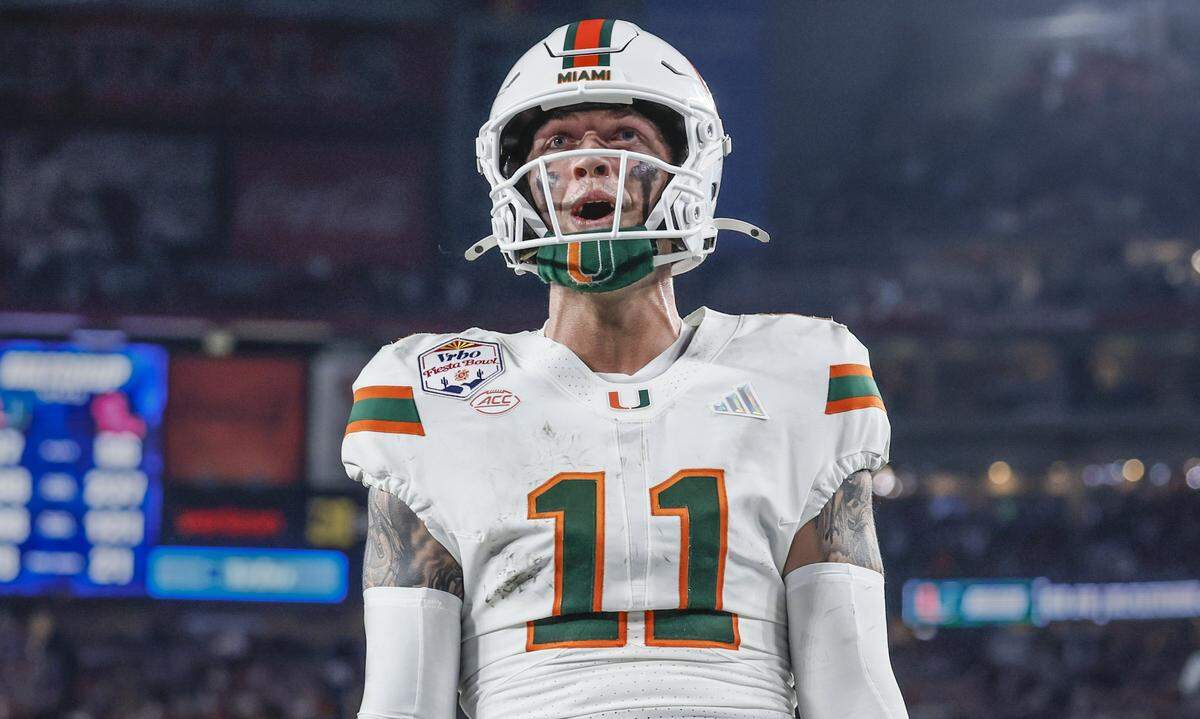 Miami Hurricanes quarterback Carson Beck (11) reacts after scoring during the second half of a College Football Playoff semifinal against the Mississippi Rebels in the Fiesta Bowl at State Farm Stadium on Friday, January 9, 2026 in Glendale, Arizona.