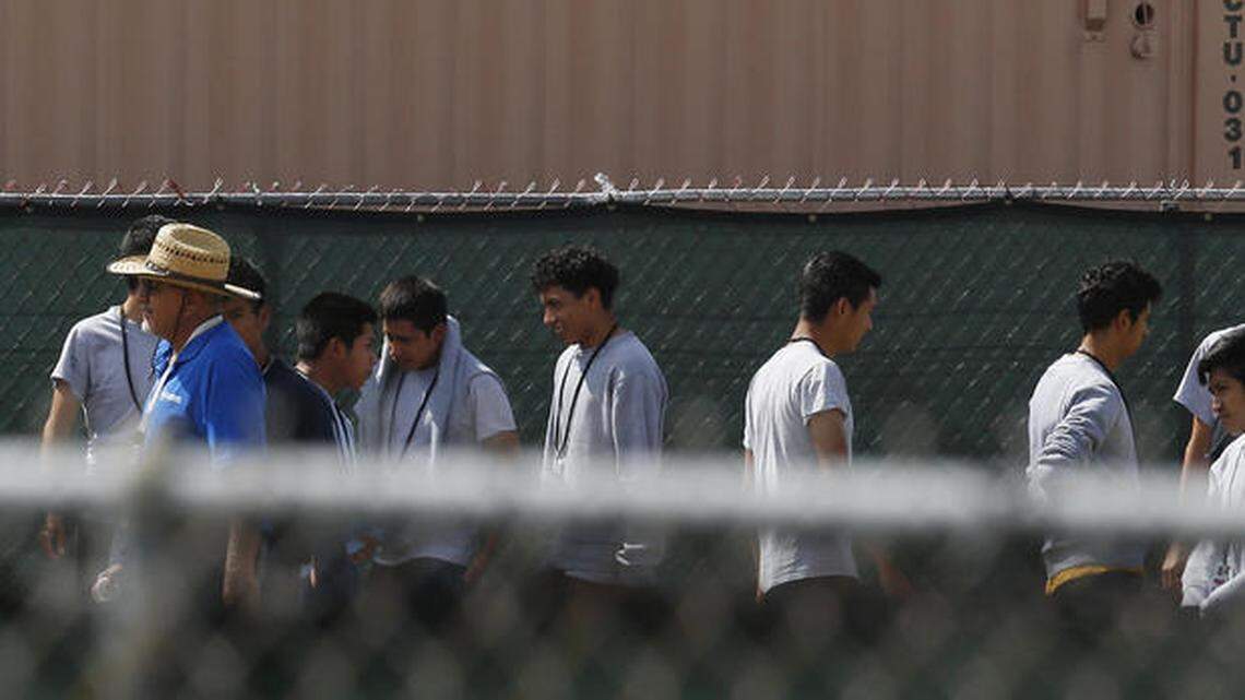 Migrant children walk outside at the Homestead Temporary Shelter for Unaccompanied Children in 2018.